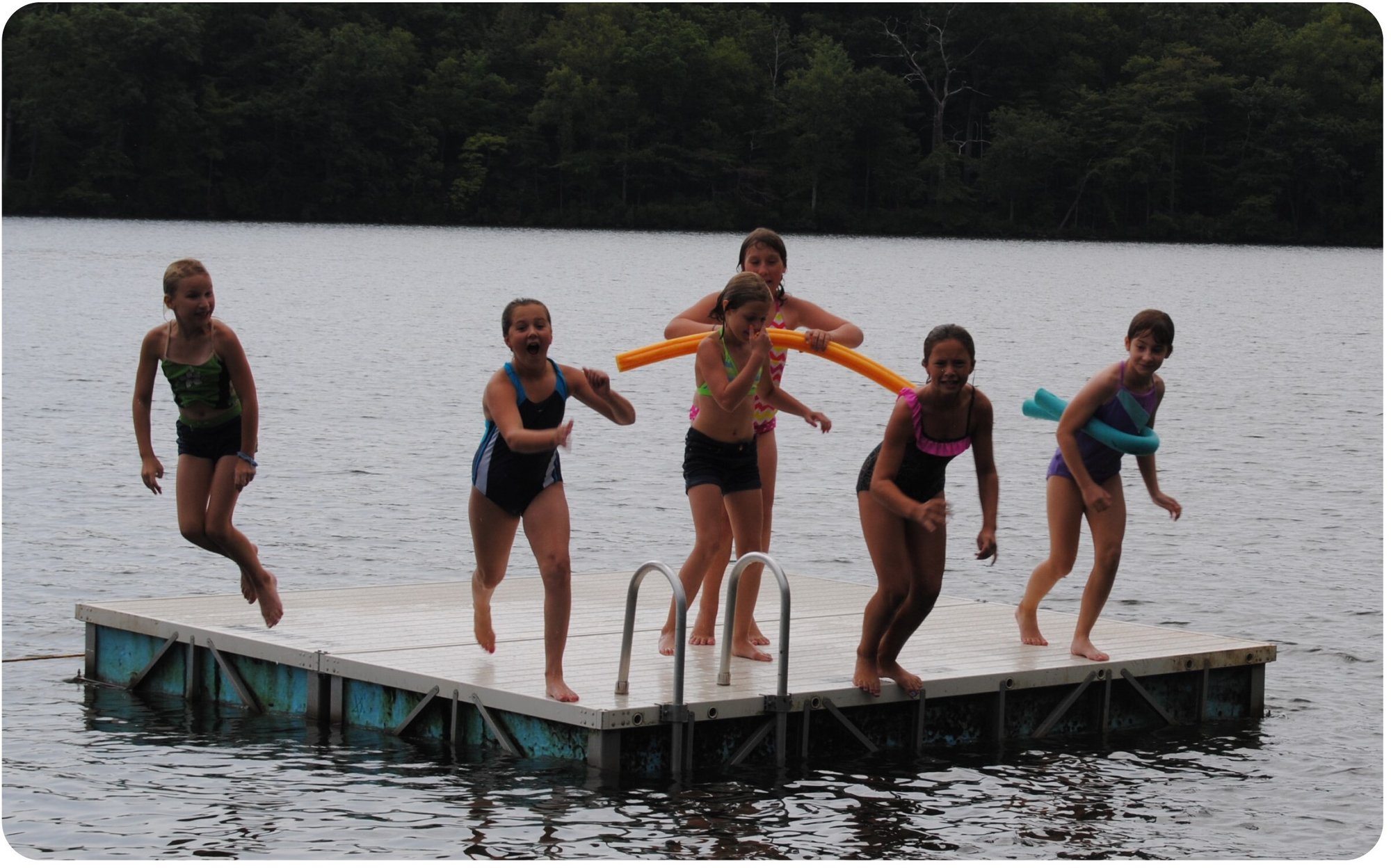Kids jumping in lake at Blue Mountain Day Camp