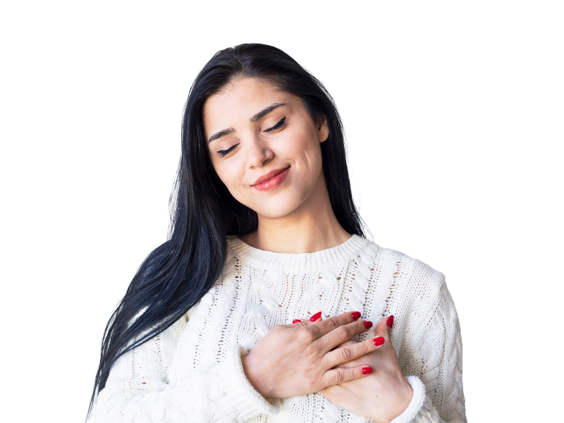 A woman holding her hands over her heart