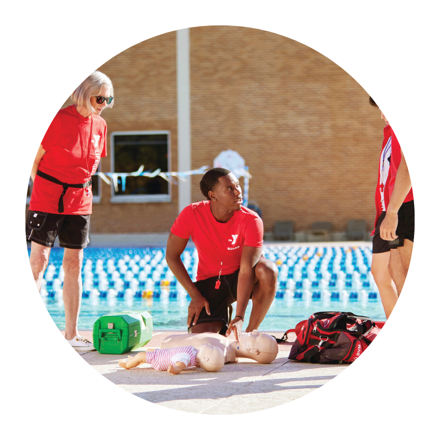 YMCA staff teaching cpr