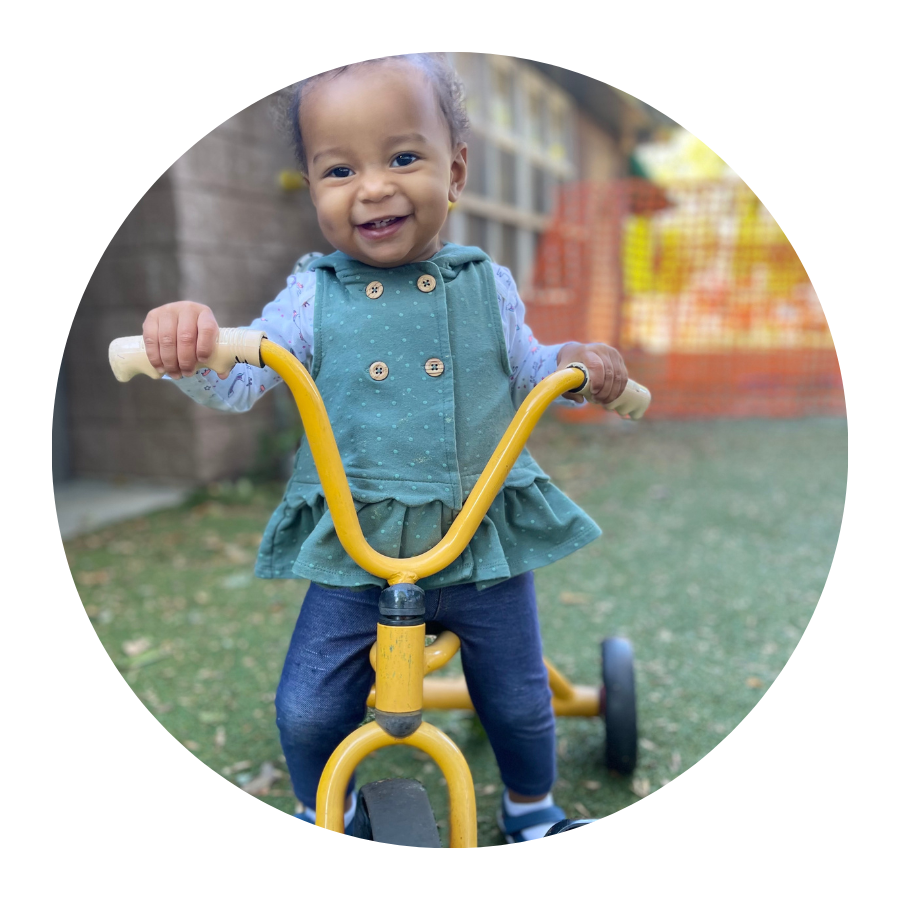 Little girl on a tricycle