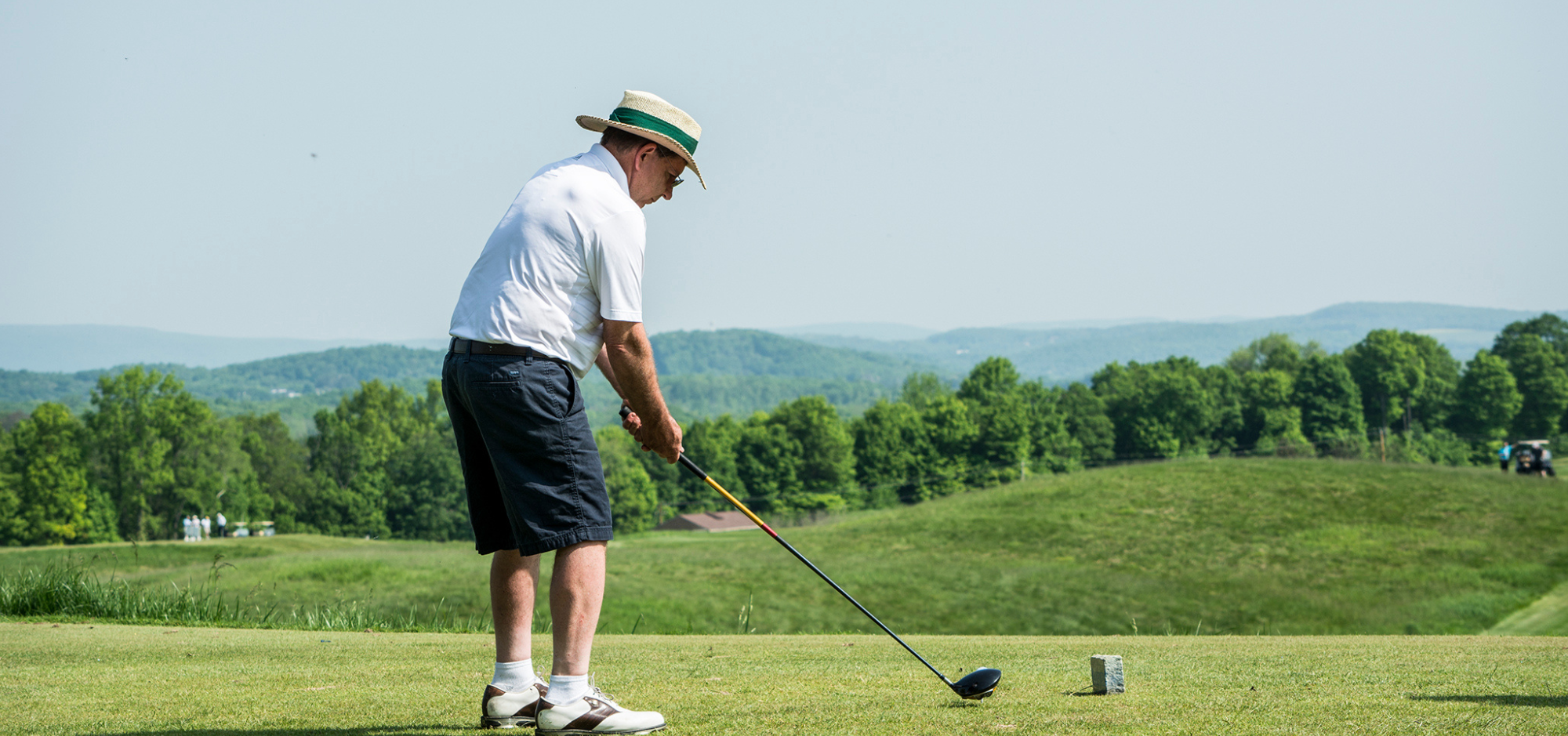 A gentleman teeing off at the Sussex County YMCA Golf Outing