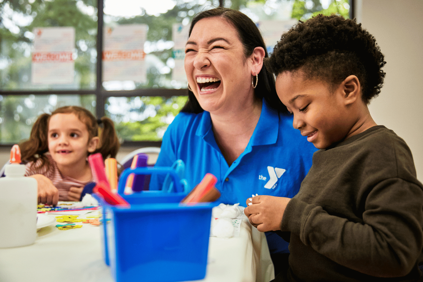 YMCA Child care instructor with children