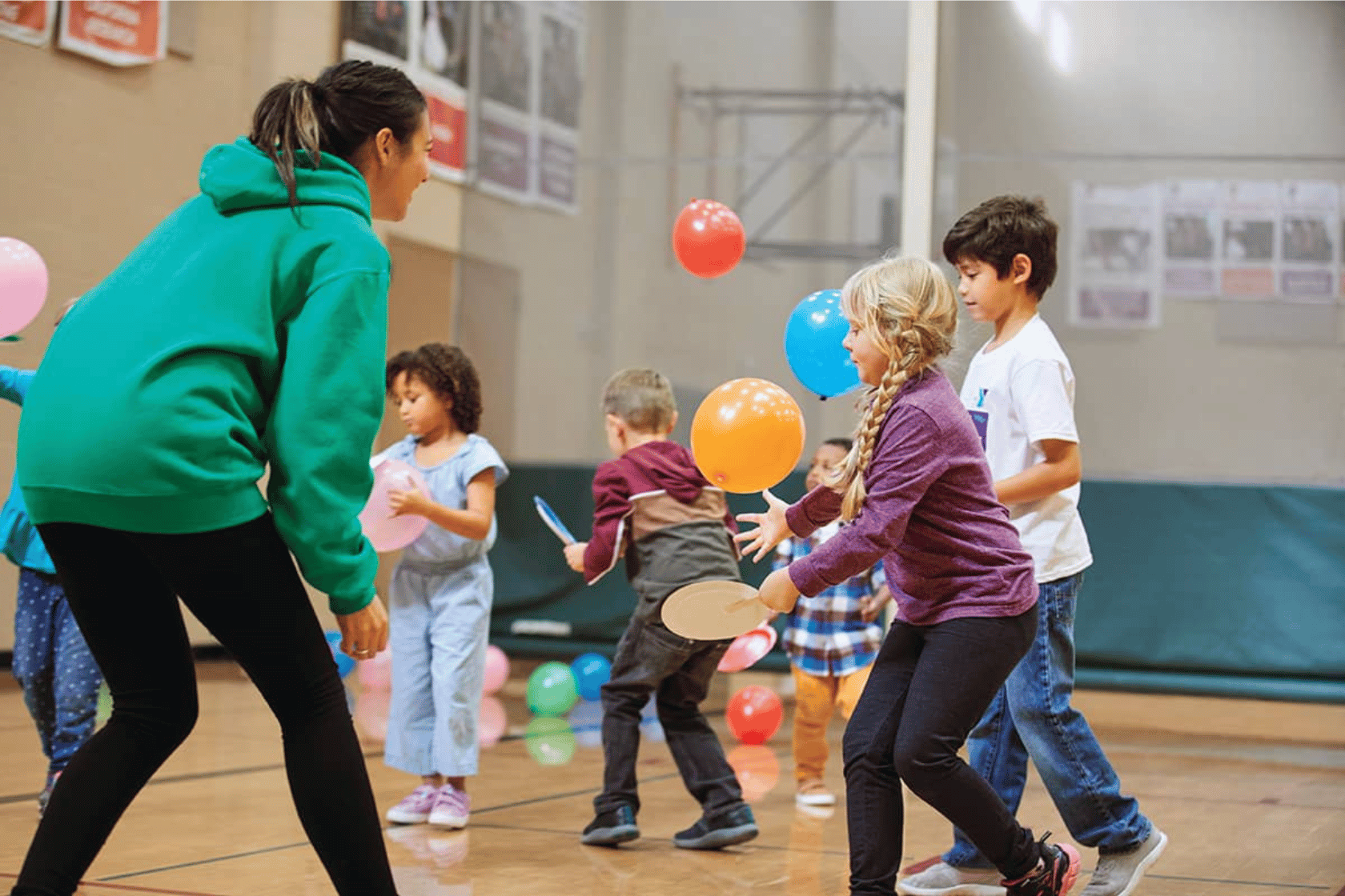Kids having a birthday party at the YMCA gym.