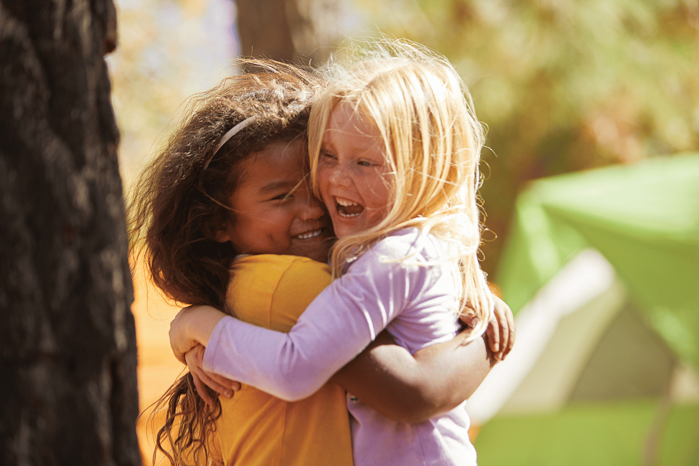 Preschool kids hugging 