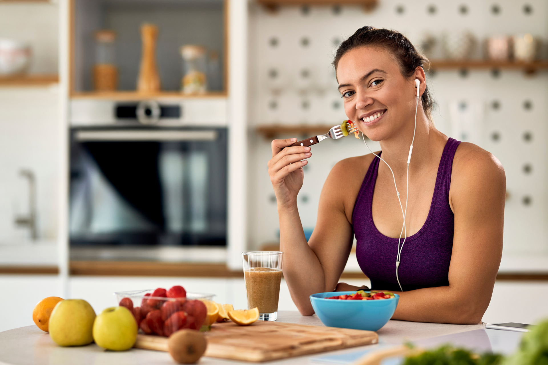 Adult woman eating healthy after a workout at the Metro YMCA of the Oranges
