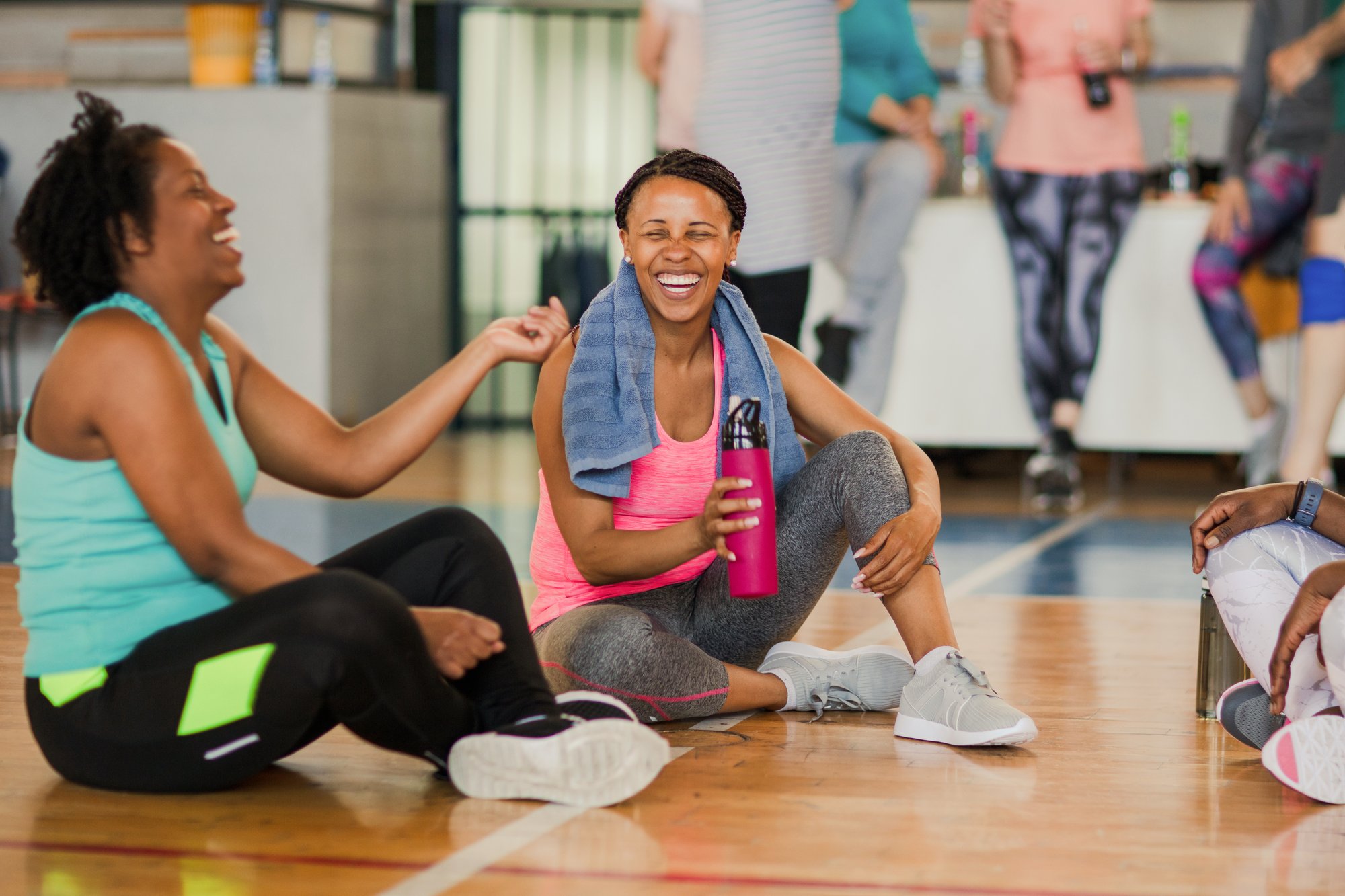Women laughing after a group exercise class at the YMCA