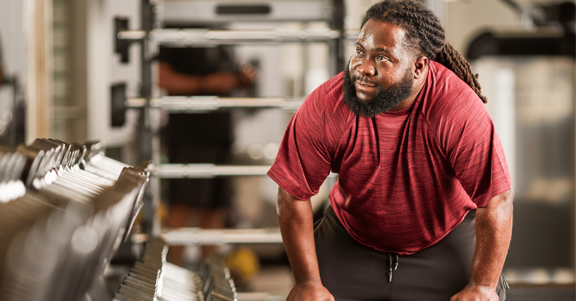 African american man lifting weights at the YMCA
