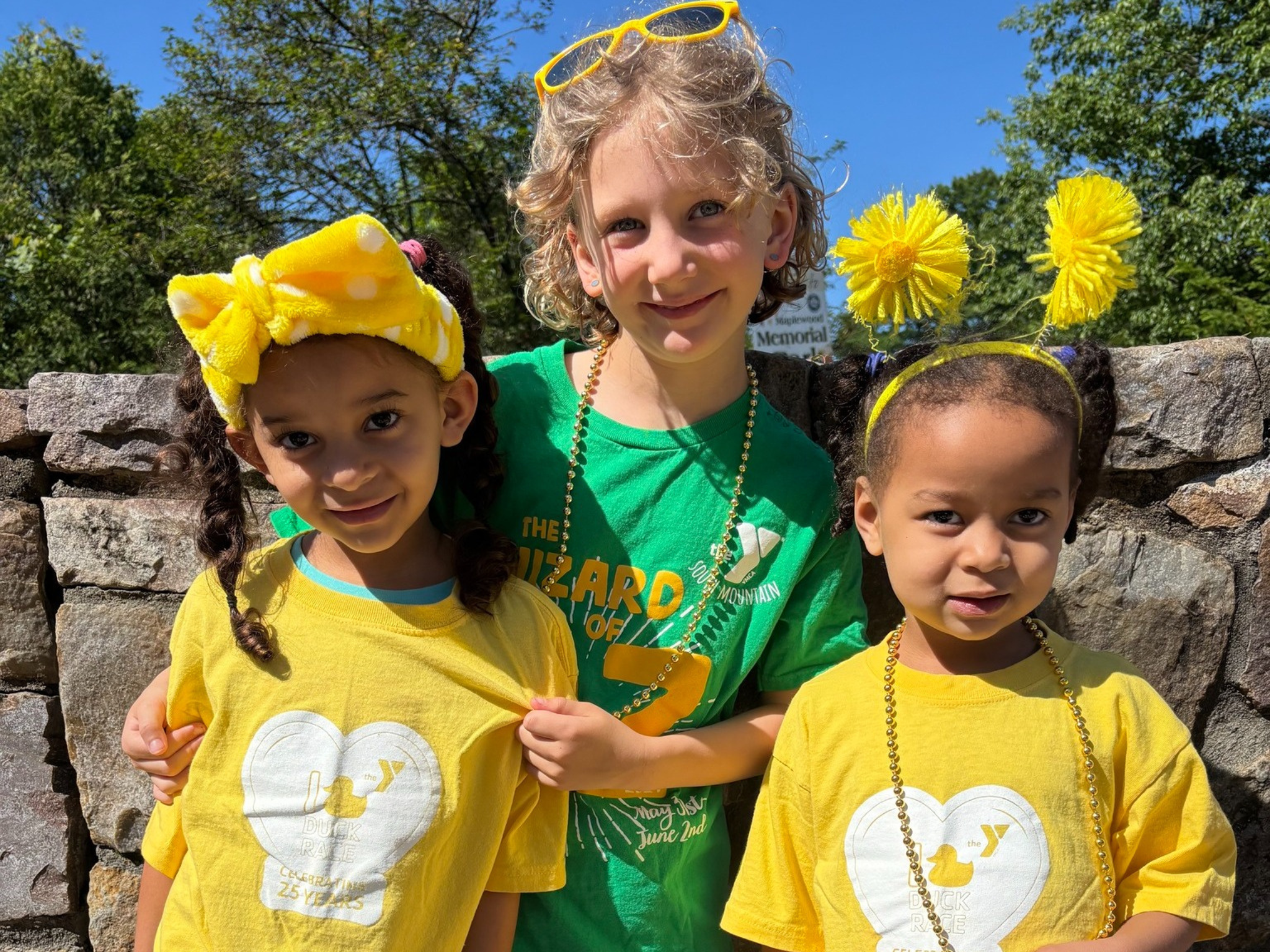 Three young girls enjoying the South Mountain YMCA Duck Race