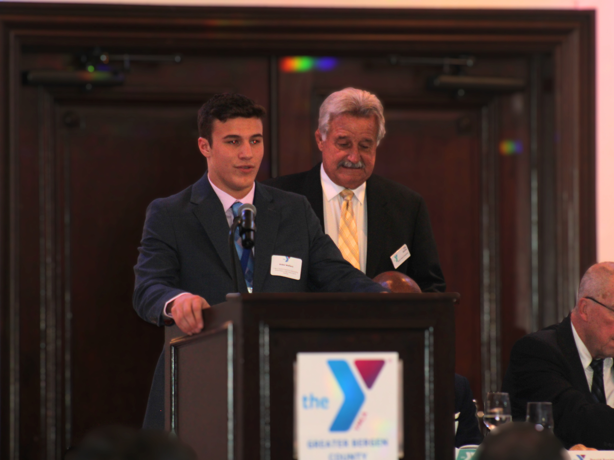 Young man recieving an award at the Greater Bergen Sports Awards Banquet