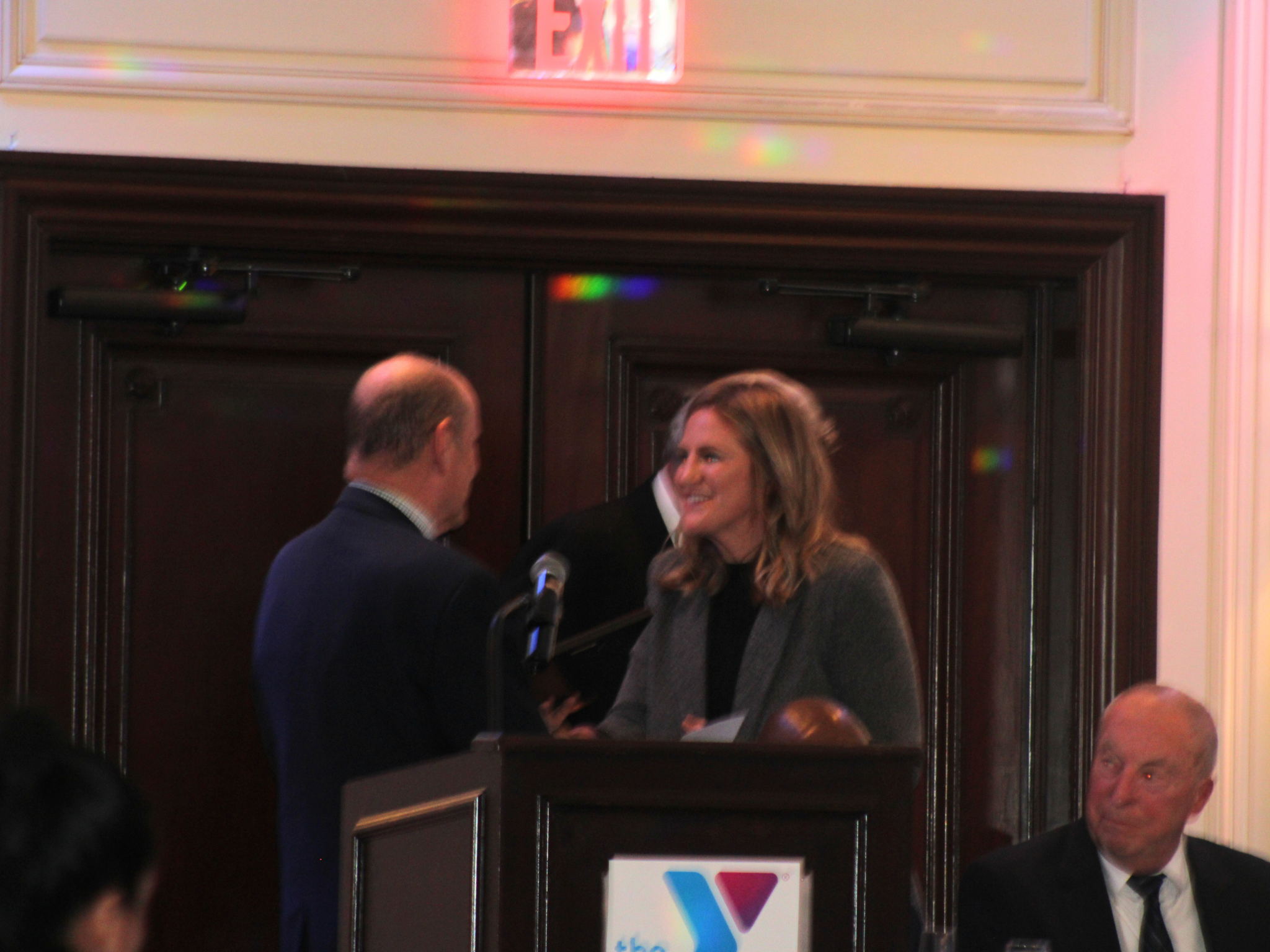 Young woman receiving and award at the Greater Bergen Sports Awards Banquet