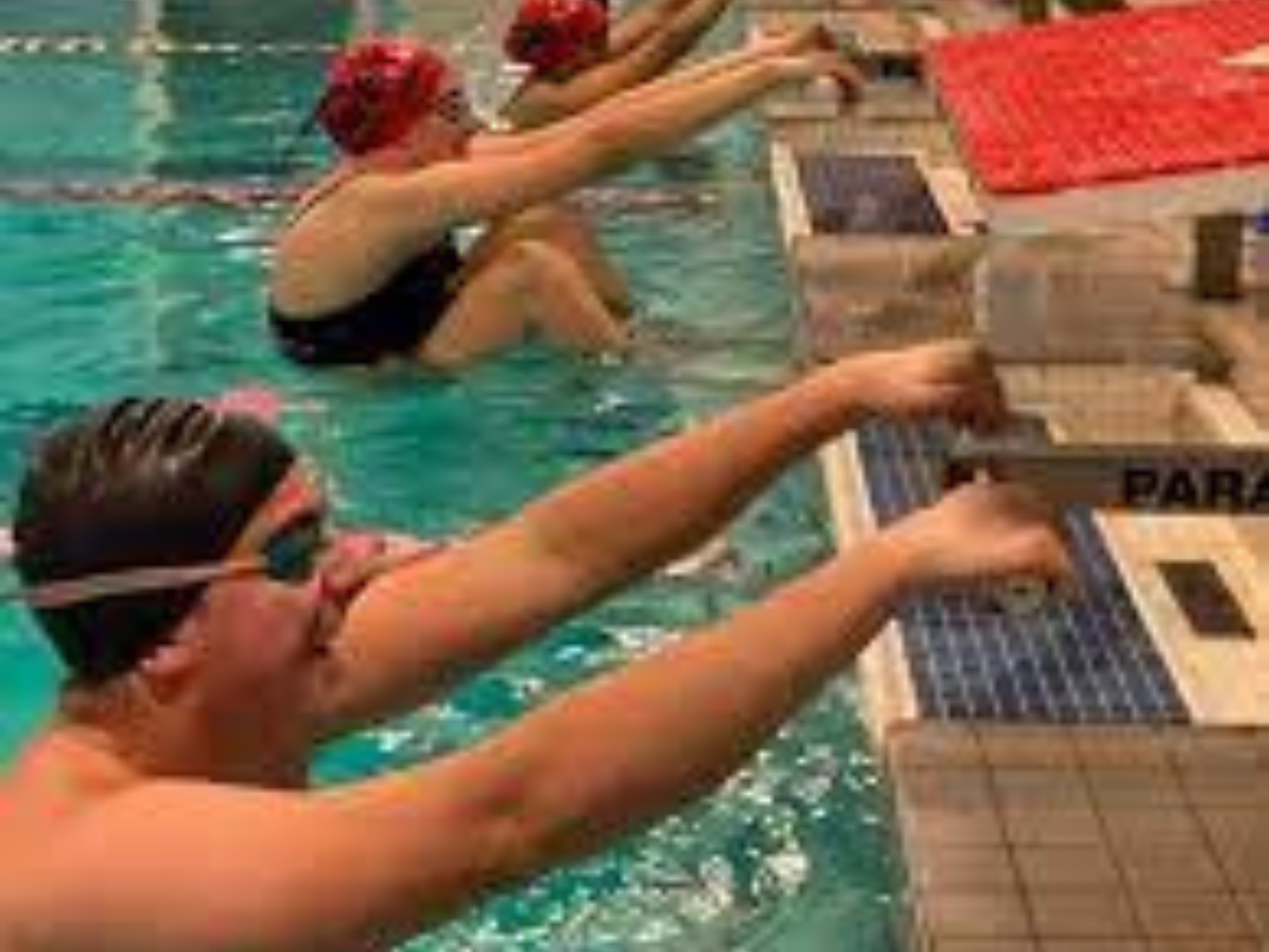 Sussex County YMCA Masters swim team members at their marks