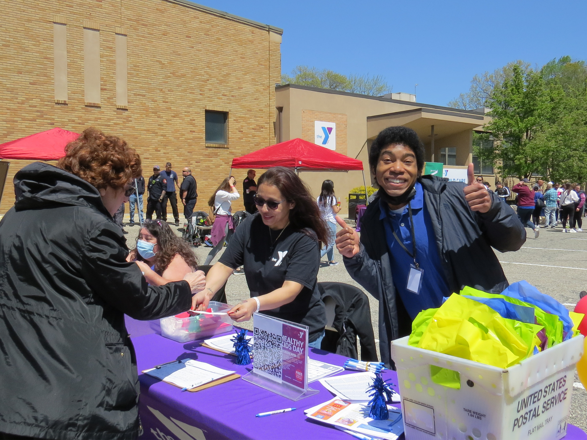 YMCA staff checking families in at Healthy Kids Day