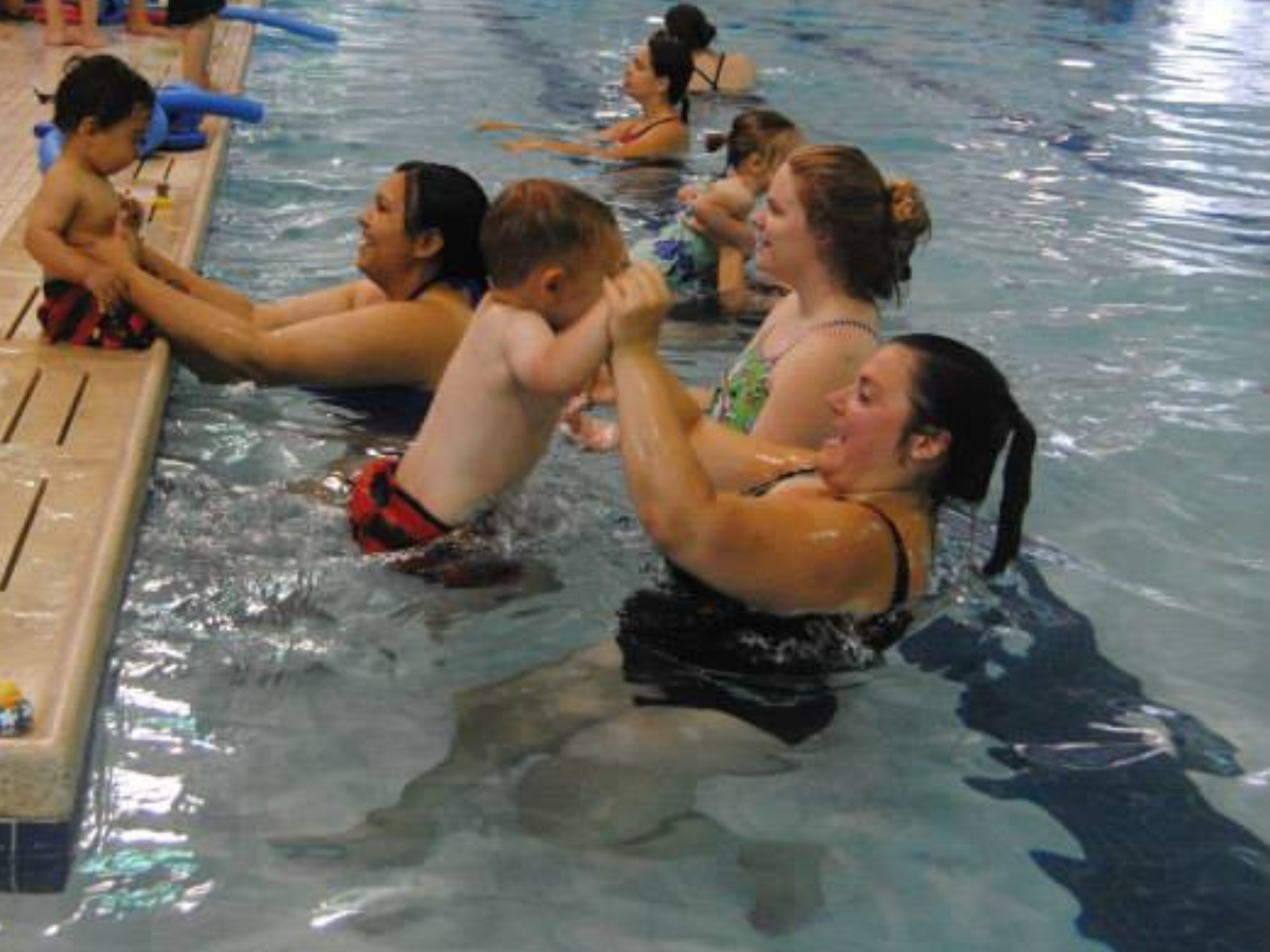 Parents and kids participating in the YMCAs Safety Around Water activities