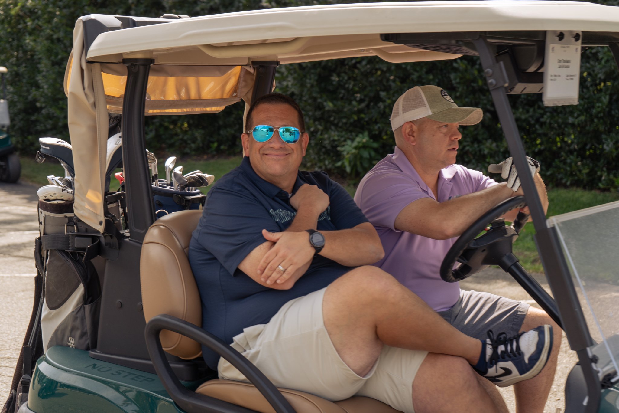 Two Y members on a golf cart at the Sussex County YMCA Golf Outing