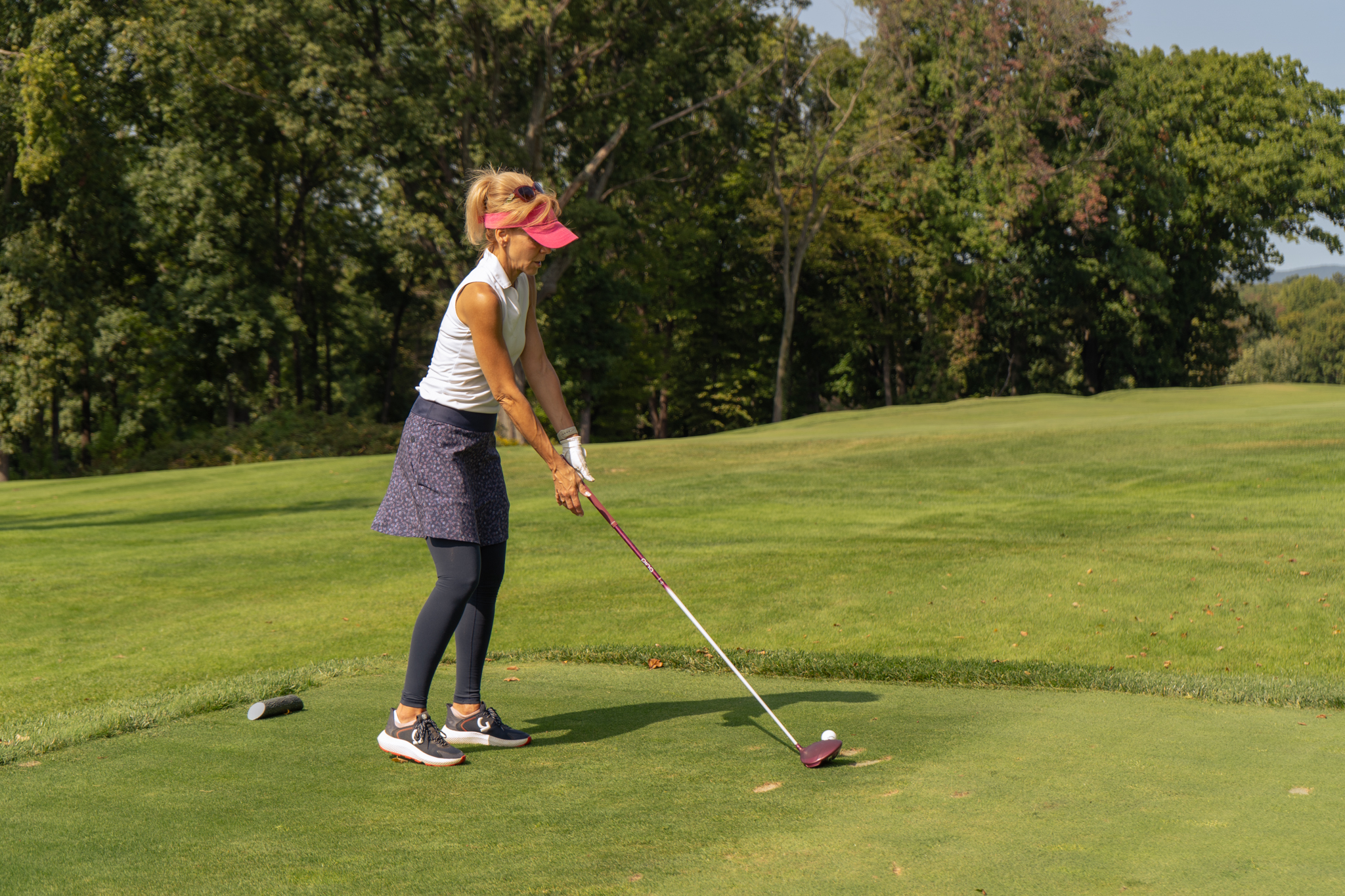 A women teeing up her shot at the Sussex County YMCA Golf Outing