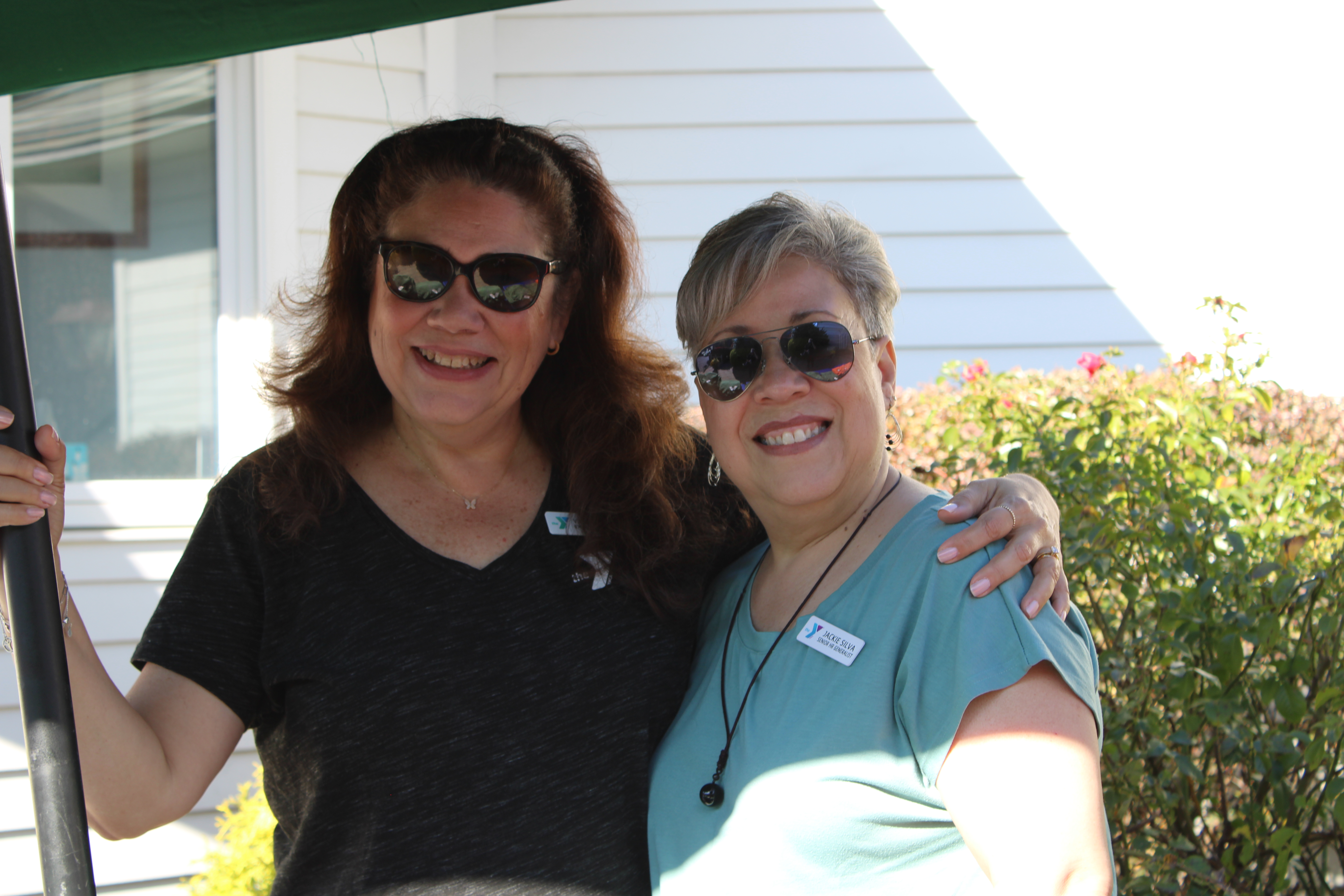 Two Y staff pose for a photo at the Metro YMCA Golf Outing in New Jersey