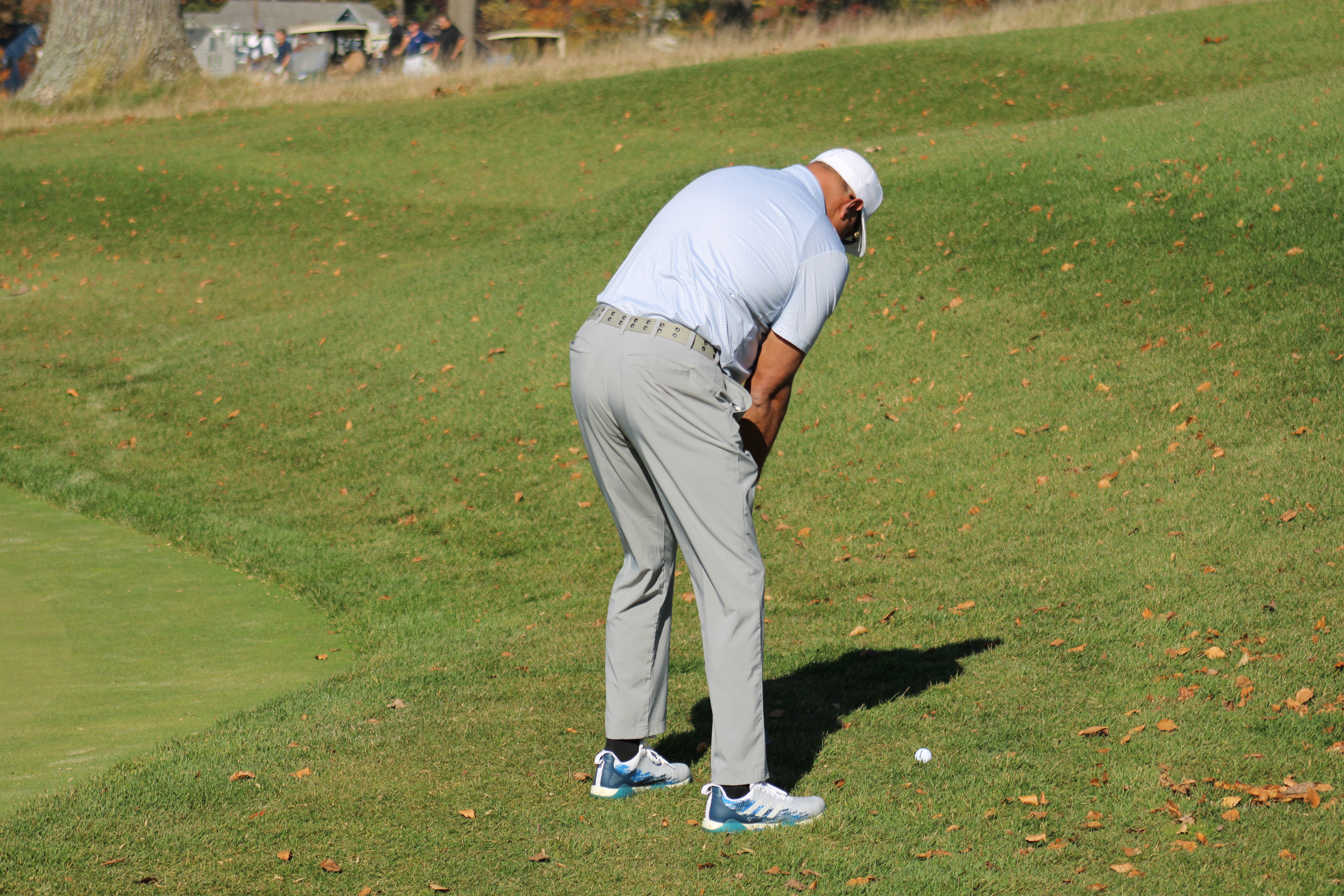 A participant reading for a chip shot at the Metro YMCA Golf Outing in New Jersey