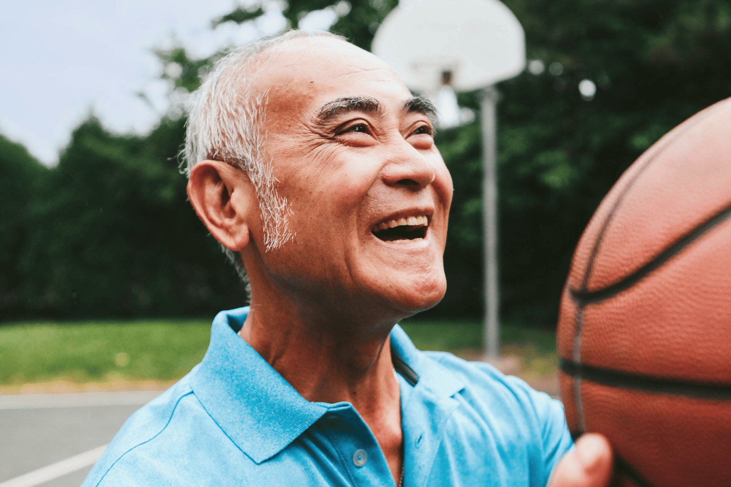 Senior gentleman shooting basketball at the Metro YMCA of the Oranges