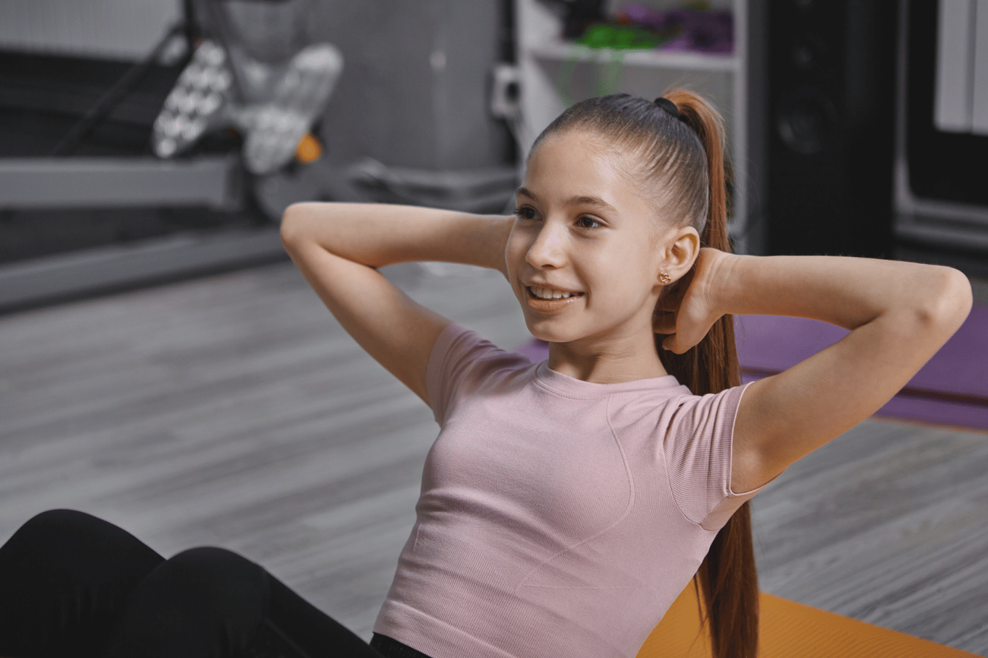 Teenage girl working out at the YMCA